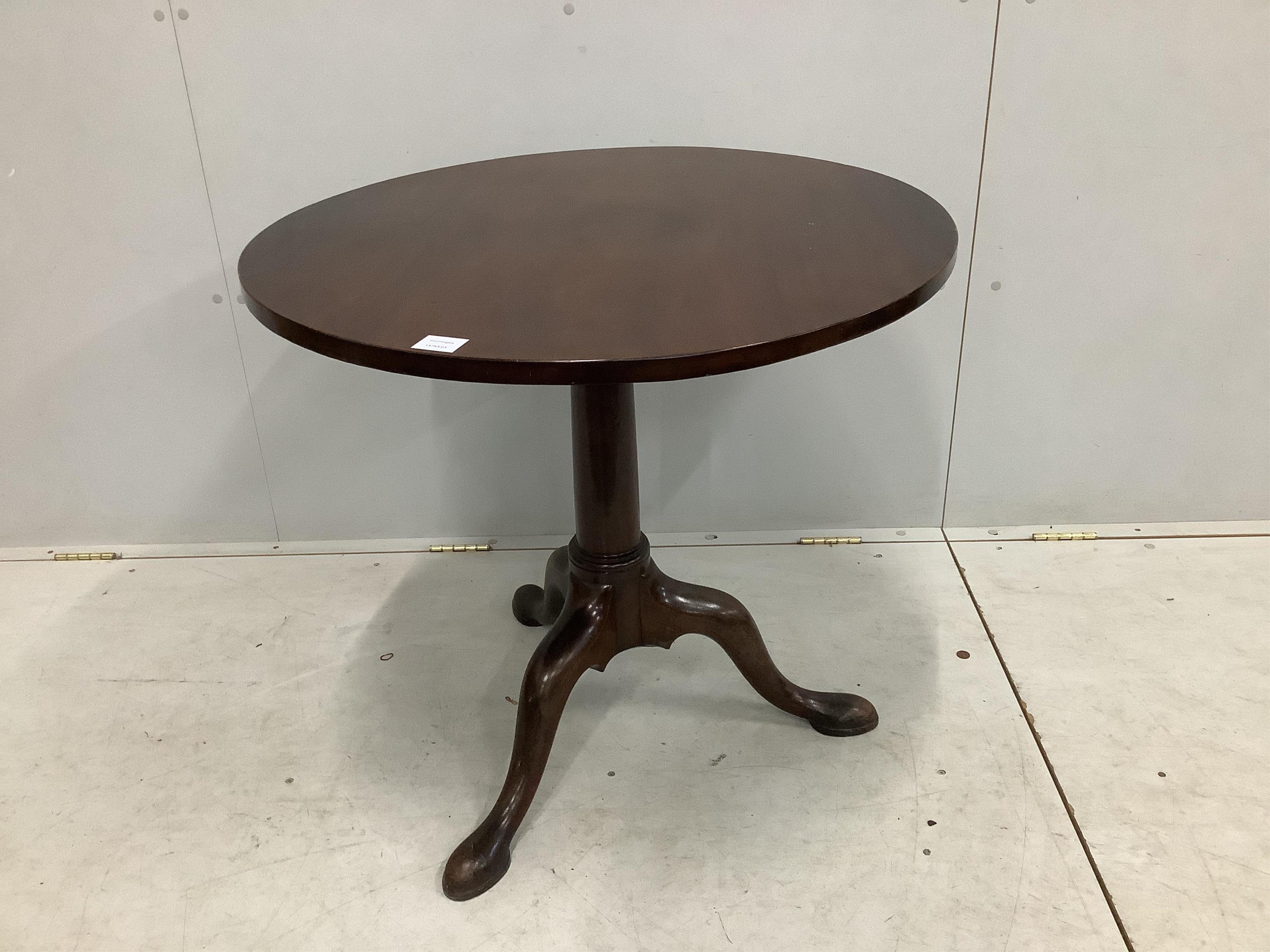 A George III circular mahogany tilt top tea table, diameter 81cm, height 71cm. Condition - fair to good